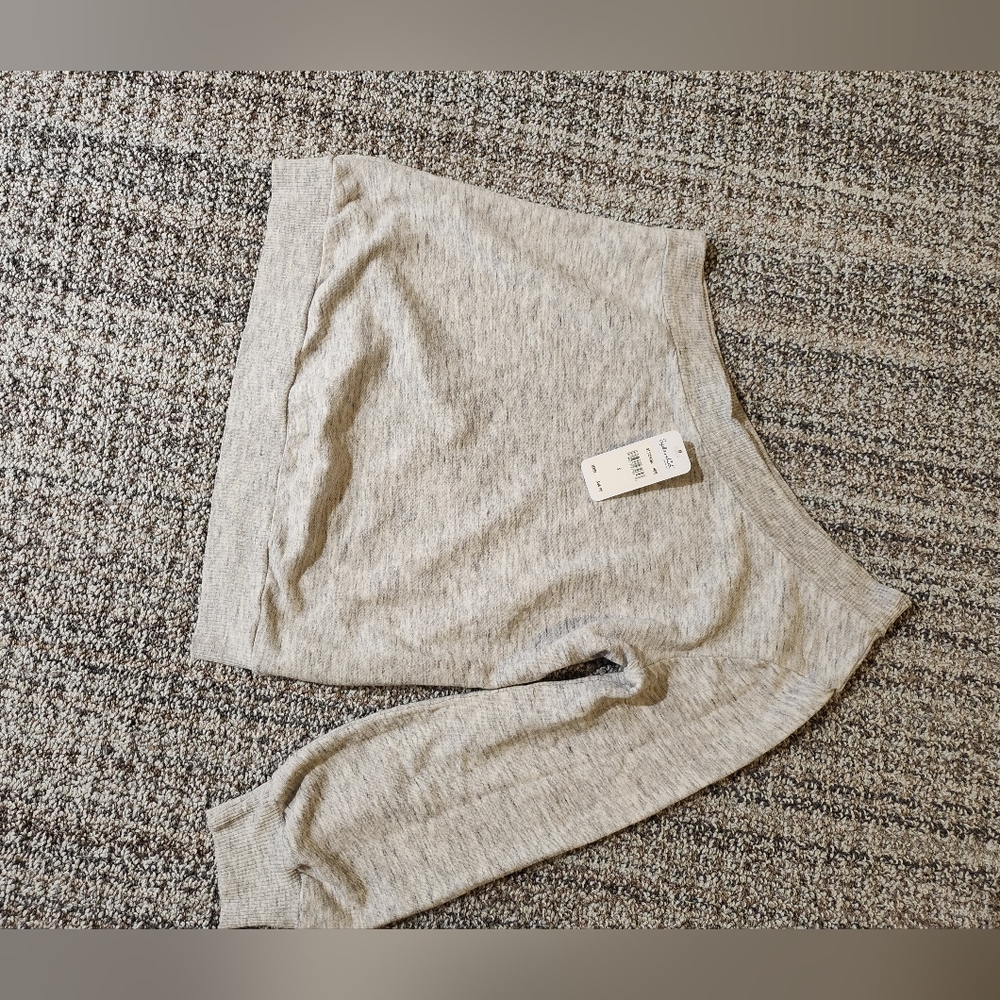 One shoulder sweatshirt.